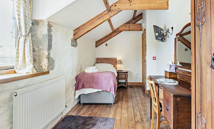 Room 5, sleeps 1 with a single bed & a shower en-suite